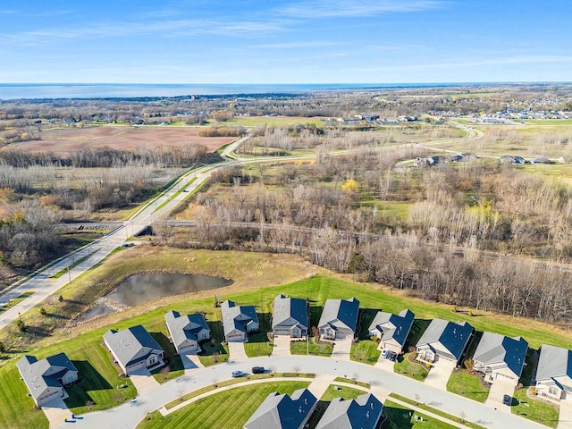bird's eye view featuring a water view and a residential view