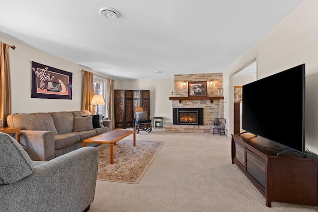 living area with light colored carpet and a fireplace