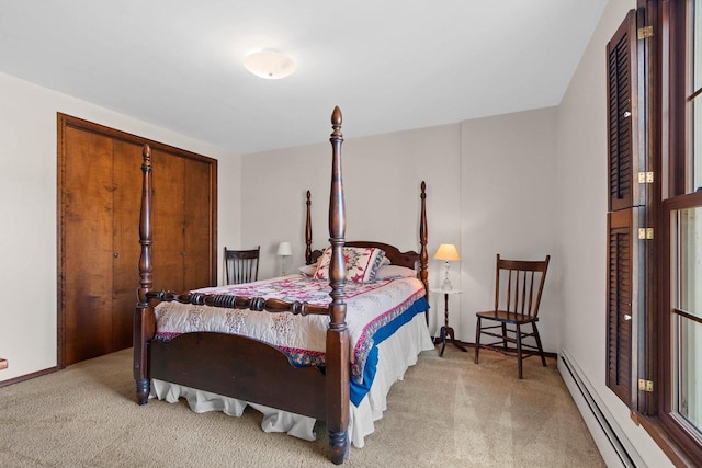 bedroom featuring carpet and a baseboard heating unit