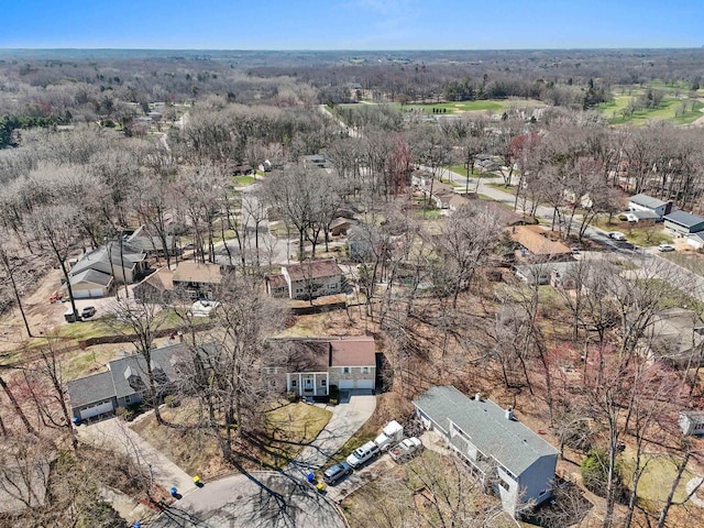 birds eye view of property with a view of trees and a residential view