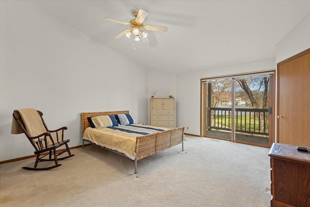 bedroom featuring baseboards, light carpet, lofted ceiling, and access to exterior