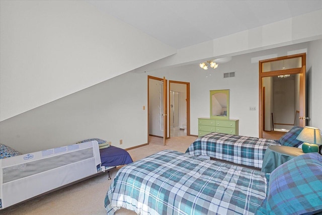 carpeted bedroom featuring visible vents, baseboards, and a notable chandelier