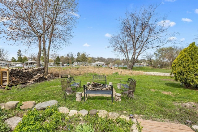 view of yard with an outdoor fire pit
