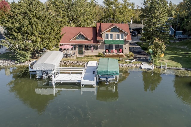 dock area with a water view and boat lift