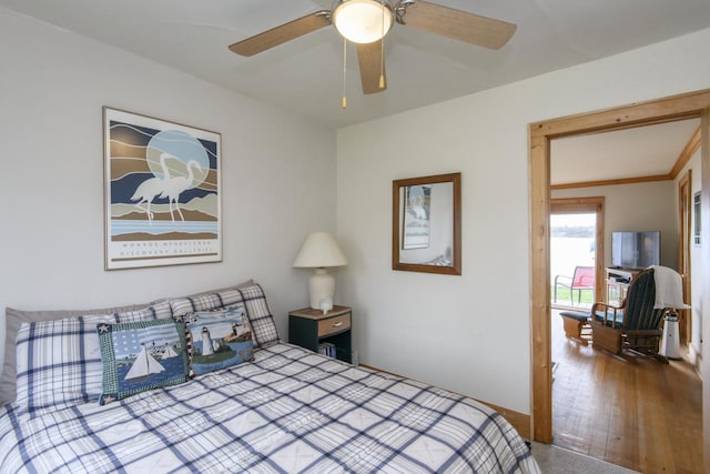 bedroom featuring a ceiling fan and baseboards