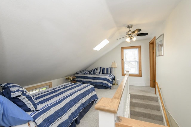 bedroom with ceiling fan, vaulted ceiling, and light carpet
