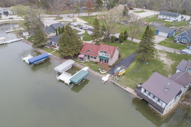 bird's eye view with a water view and a residential view