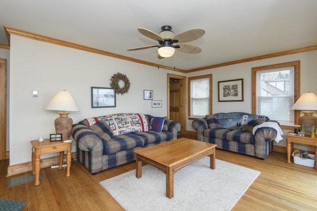 living room featuring light wood-type flooring, crown molding, and ceiling fan