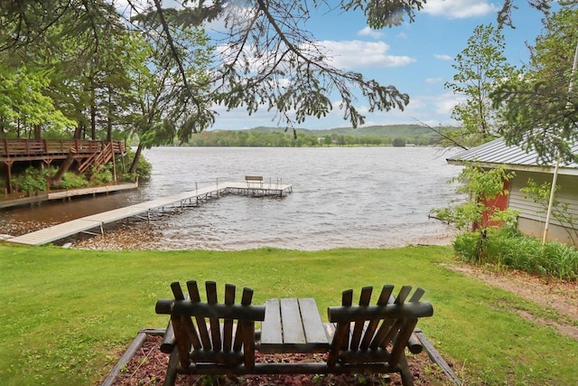 S9073 Timbercrest Trl, Prairie Du Sac, WI 53578 - view of grassy yard featuring a boat dock and a water view