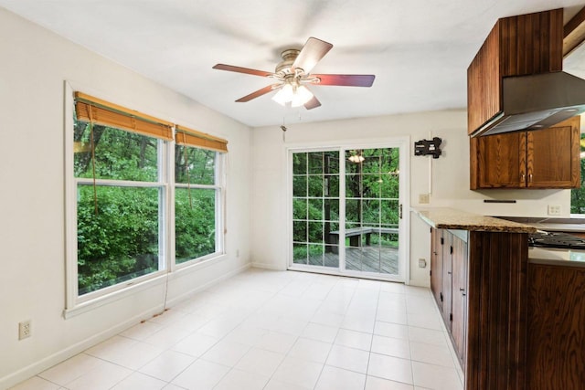 S9073 Timbercrest Trl, Prairie Du Sac, WI 53578 - kitchen featuring plenty of natural light, a ceiling fan, and baseboards