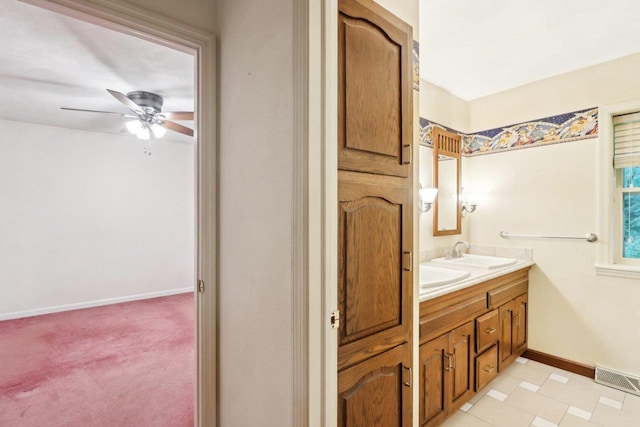 S9073 Timbercrest Trl, Prairie Du Sac, WI 53578 - full bath with double vanity, ceiling fan, and baseboards