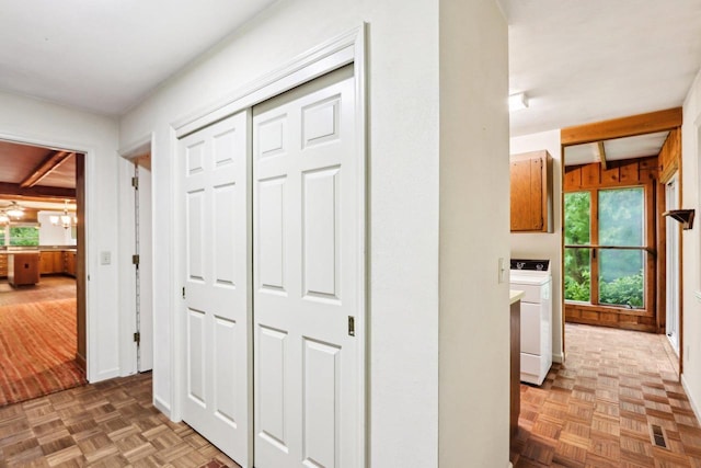 S9073 Timbercrest Trl, Prairie Du Sac, WI 53578 - corridor featuring washer / clothes dryer, beam ceiling, and a chandelier