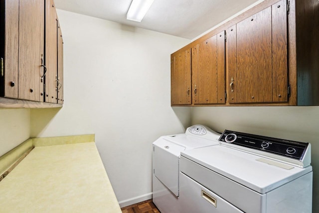 S9073 Timbercrest Trl, Prairie Du Sac, WI 53578 - washroom featuring cabinet space, washing machine and dryer, and baseboards