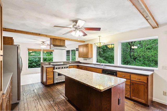 S9073 Timbercrest Trl, Prairie Du Sac, WI 53578 - kitchen with appliances with stainless steel finishes, a sink, beamed ceiling, wall chimney range hood, and a peninsula