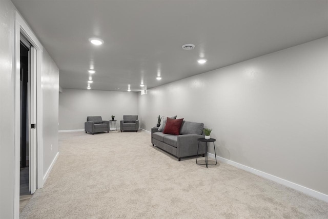 living area featuring recessed lighting, baseboards, and carpet