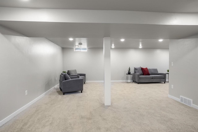 finished below grade area featuring baseboards, carpet, recessed lighting, and visible vents
