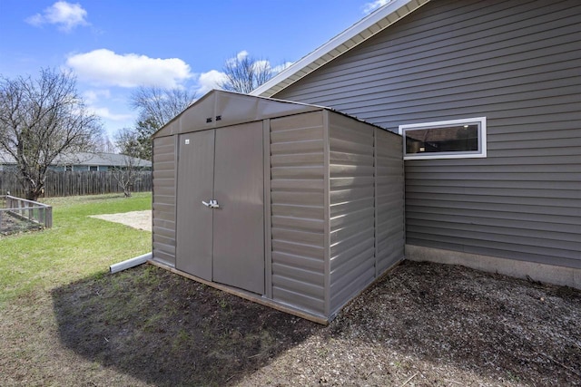view of shed with fence