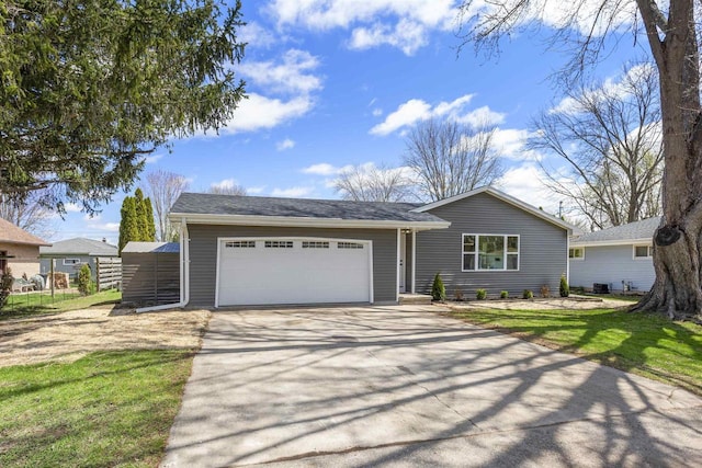 ranch-style home with concrete driveway and a garage