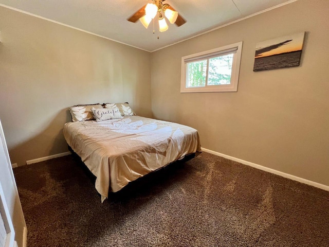 carpeted bedroom featuring crown molding, a ceiling fan, and baseboards