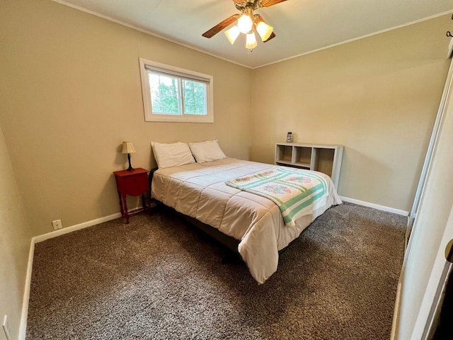 bedroom with crown molding, a ceiling fan, baseboards, and carpet floors