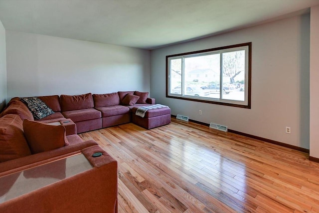 511 Linda Rd, Mount Horeb, WI 53572 - living room featuring light wood-type flooring and baseboards
