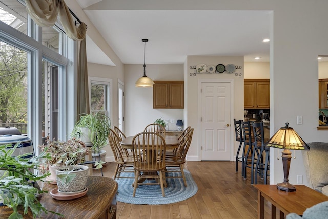 dining space with recessed lighting and hardwood / wood-style flooring