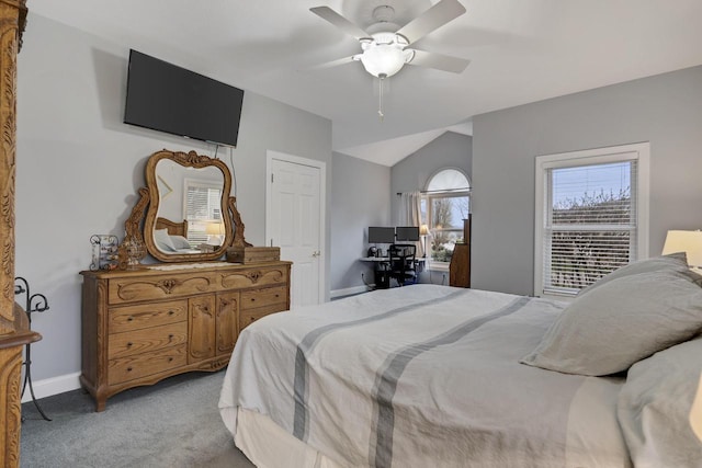 bedroom with baseboards, light colored carpet, ceiling fan, and lofted ceiling
