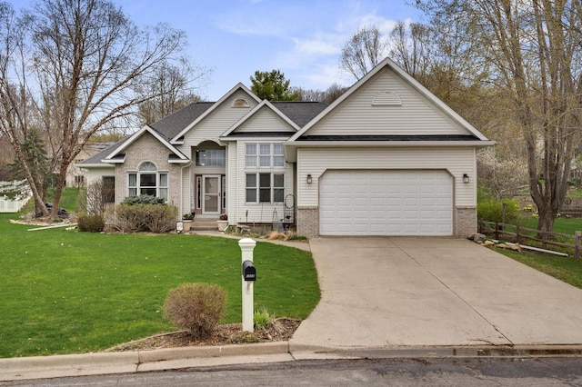 traditional-style house with fence, brick siding, a garage, a front yard, and driveway