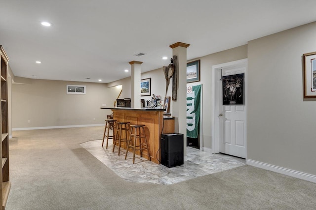 bar featuring recessed lighting, wet bar, baseboards, and light carpet