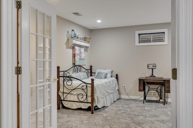 bedroom featuring baseboards and visible vents