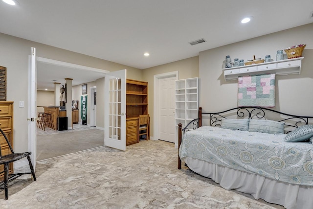 carpeted bedroom featuring recessed lighting, visible vents, and french doors