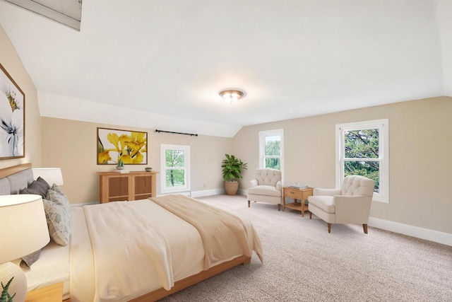1410 Sun Prairie Rd, Marshall, WI 53559 - bedroom featuring lofted ceiling, baseboards, and light carpet