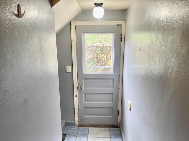 227 1st St, Baraboo, WI 53913 - doorway featuring light tile patterned floors and lofted ceiling