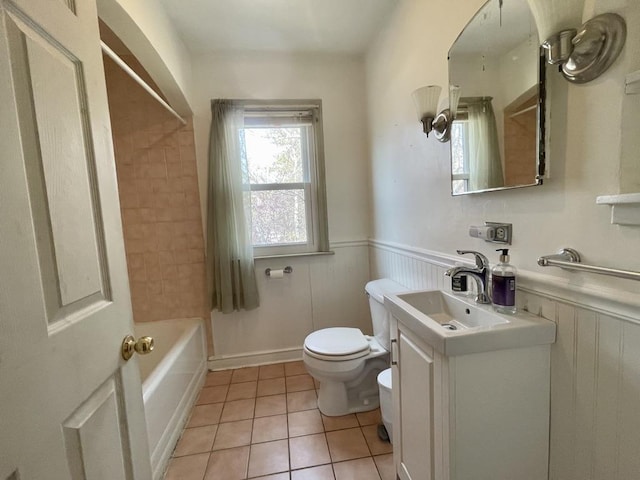 227 1st St, Baraboo, WI 53913 - full bathroom with toilet, tile patterned floors, wainscoting, and vanity