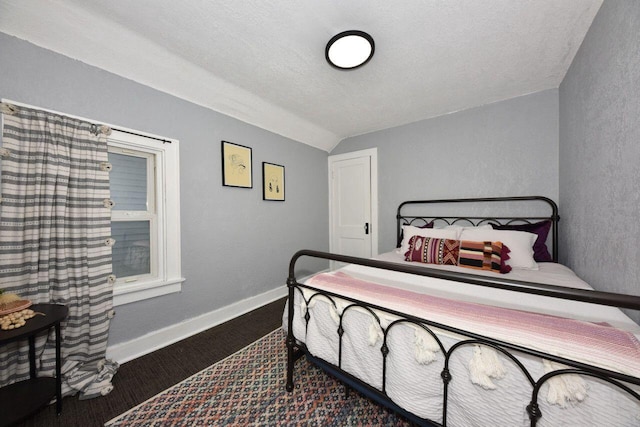 3613 N 19th St, Milwaukee, WI 53206 - bedroom featuring a textured ceiling, baseboards, and lofted ceiling