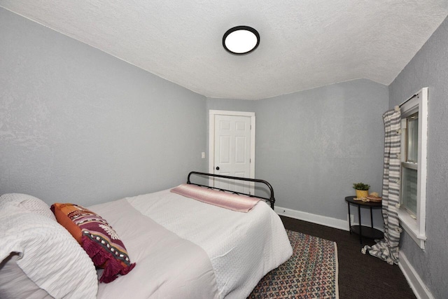 3613 N 19th St, Milwaukee, WI 53206 - bedroom featuring a textured ceiling, a textured wall, and baseboards