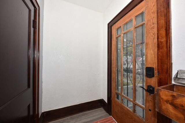 3613 N 19th St, Milwaukee, WI 53206 - doorway featuring baseboards and wood finished floors