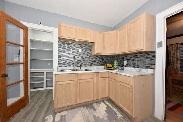 3613 N 19th St, Milwaukee, WI 53206 - kitchen with light brown cabinetry, backsplash, a sink, and light wood-type flooring
