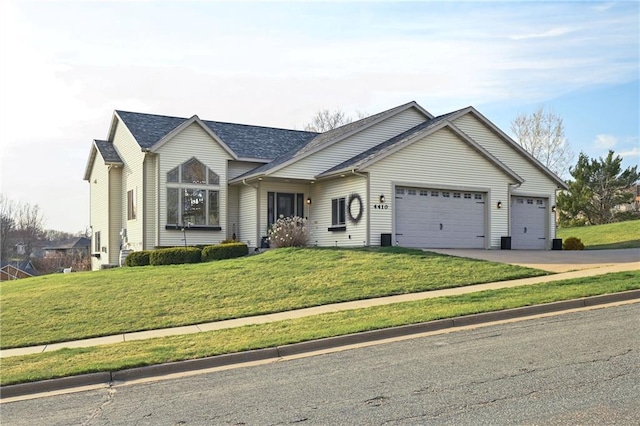 4410 Echo Valley Dr, Eau Claire, WI 54701 - single story home with driveway, a front lawn, and a garage