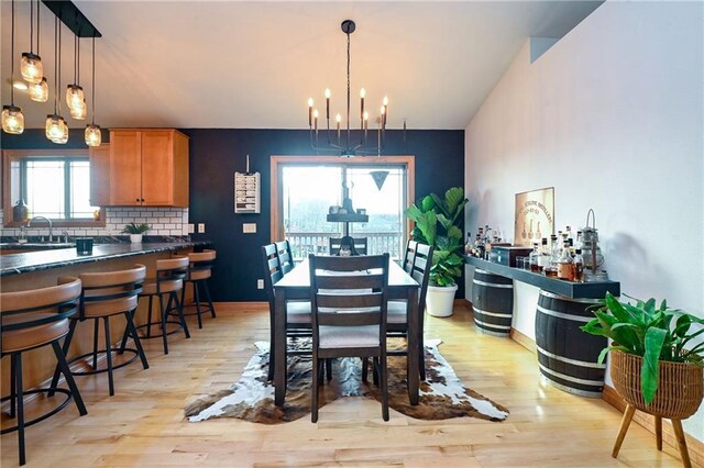 4410 Echo Valley Dr, Eau Claire, WI 54701 - dining space featuring light wood-style floors and a notable chandelier