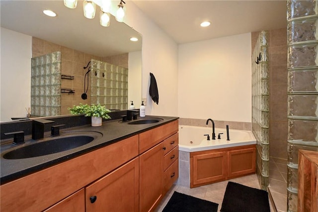 4410 Echo Valley Dr, Eau Claire, WI 54701 - bathroom with a whirlpool tub, tile patterned floors, walk in shower, and a sink