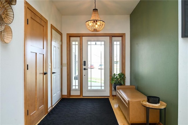 4410 Echo Valley Dr, Eau Claire, WI 54701 - entryway with baseboards and a notable chandelier