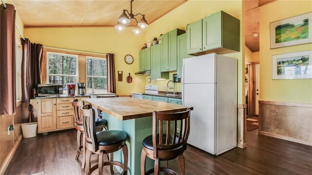 7540 Spider Lake Rd, Iron River, WI 54847 - kitchen featuring dark wood-style flooring, a sink, white appliances, vaulted ceiling, and butcher block counters