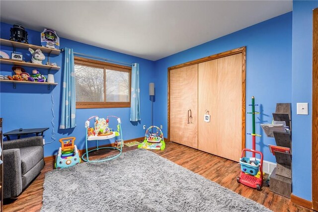 3434 Hester St, Eau Claire, WI 54701 - game room featuring baseboards and wood finished floors