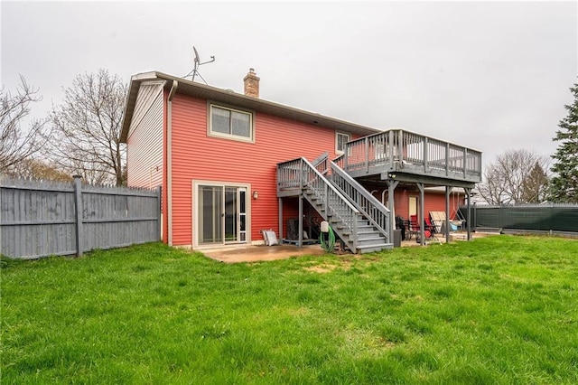 3434 Hester St, Eau Claire, WI 54701 - rear view of house with fence private yard, a wooden deck, stairs, and a chimney