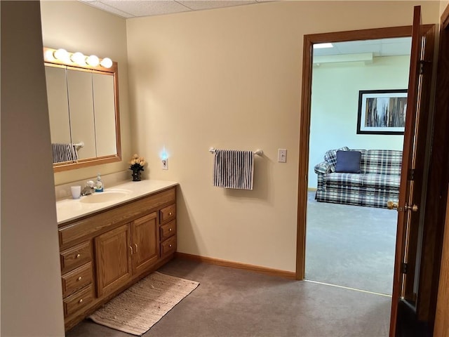 bathroom with vanity and baseboards