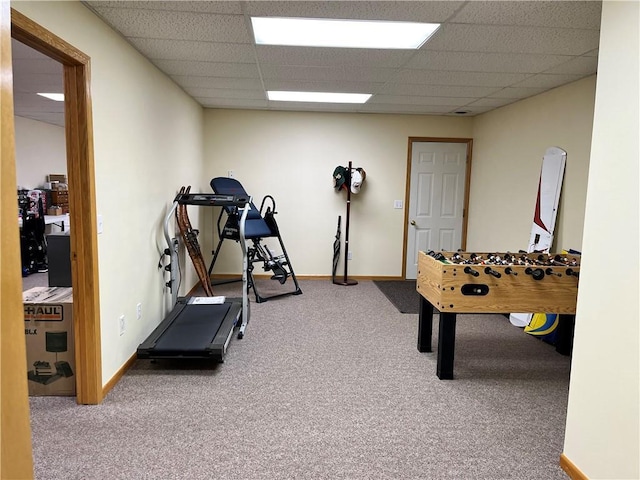 playroom featuring baseboards, carpet, and a paneled ceiling