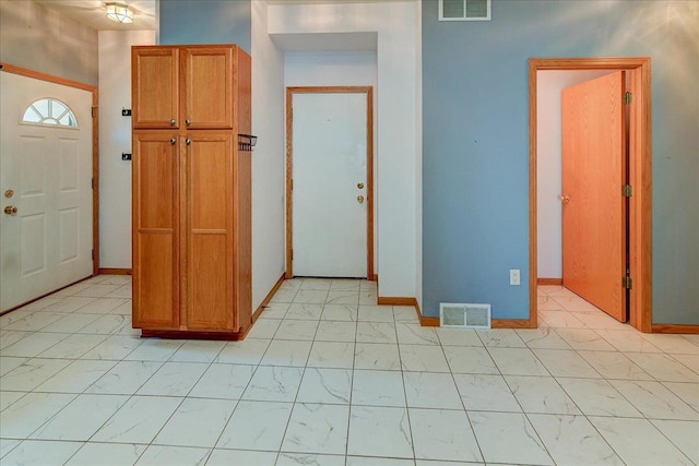 555 Kelvington Dr Unit 4, Sun Prairie, WI 53590 - foyer featuring light marble finish flooring and baseboards