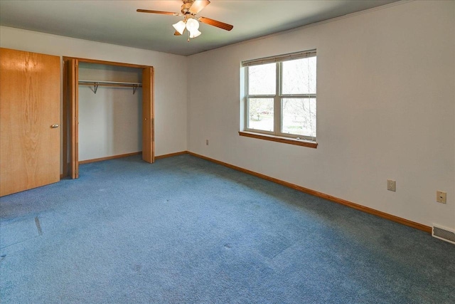 555 Kelvington Dr Unit 4, Sun Prairie, WI 53590 - unfurnished bedroom featuring carpet, baseboards, a closet, and a ceiling fan