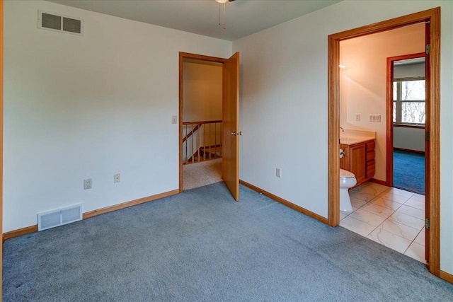555 Kelvington Dr Unit 4, Sun Prairie, WI 53590 - unfurnished bedroom featuring carpet flooring, baseboards, and ensuite bath